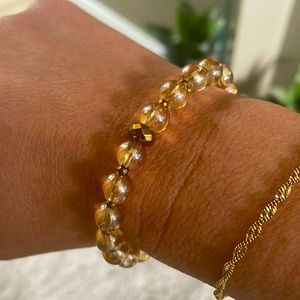 Citrine gemstone bracelet with hematite center stone.